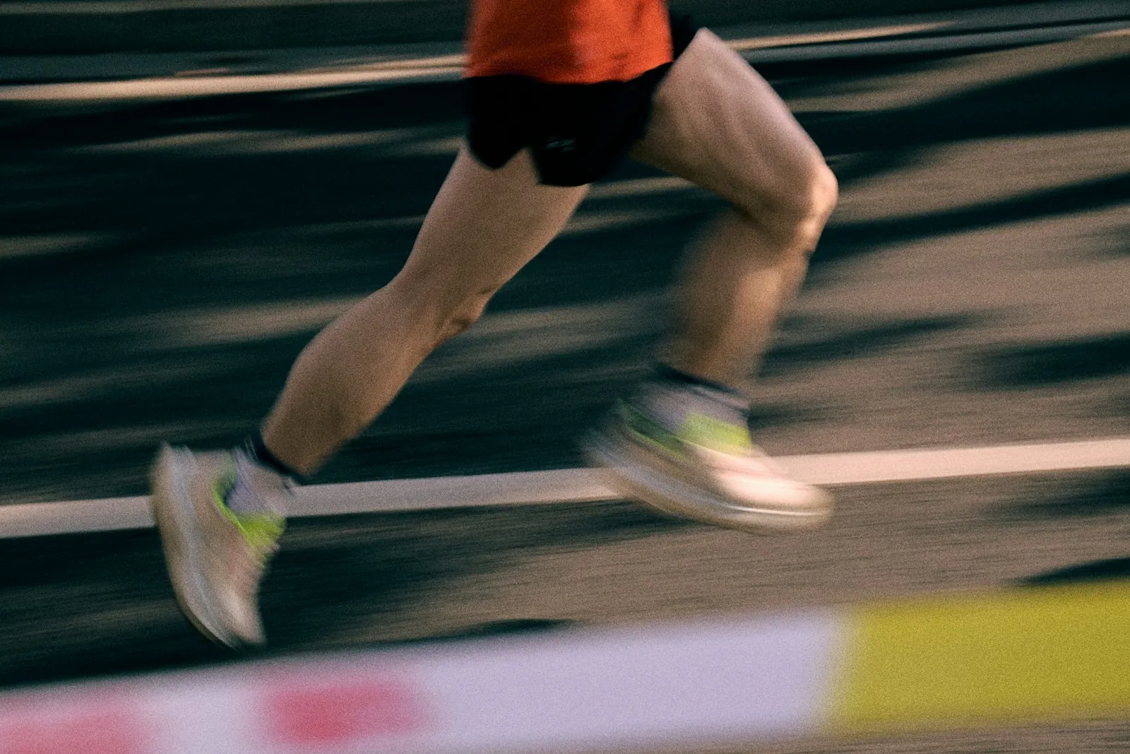 Runner sprinting along a running track