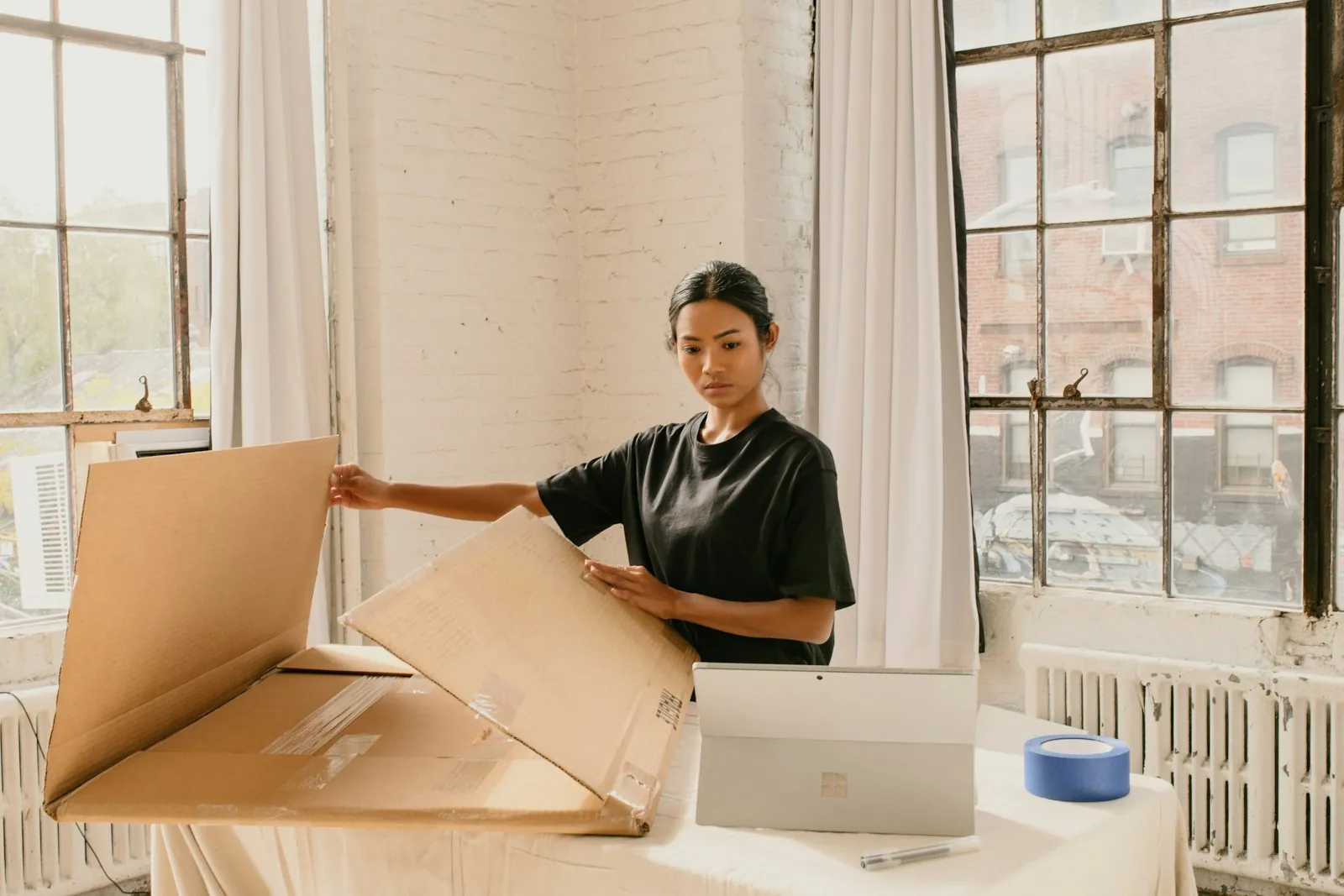 Small business owner packing an online order