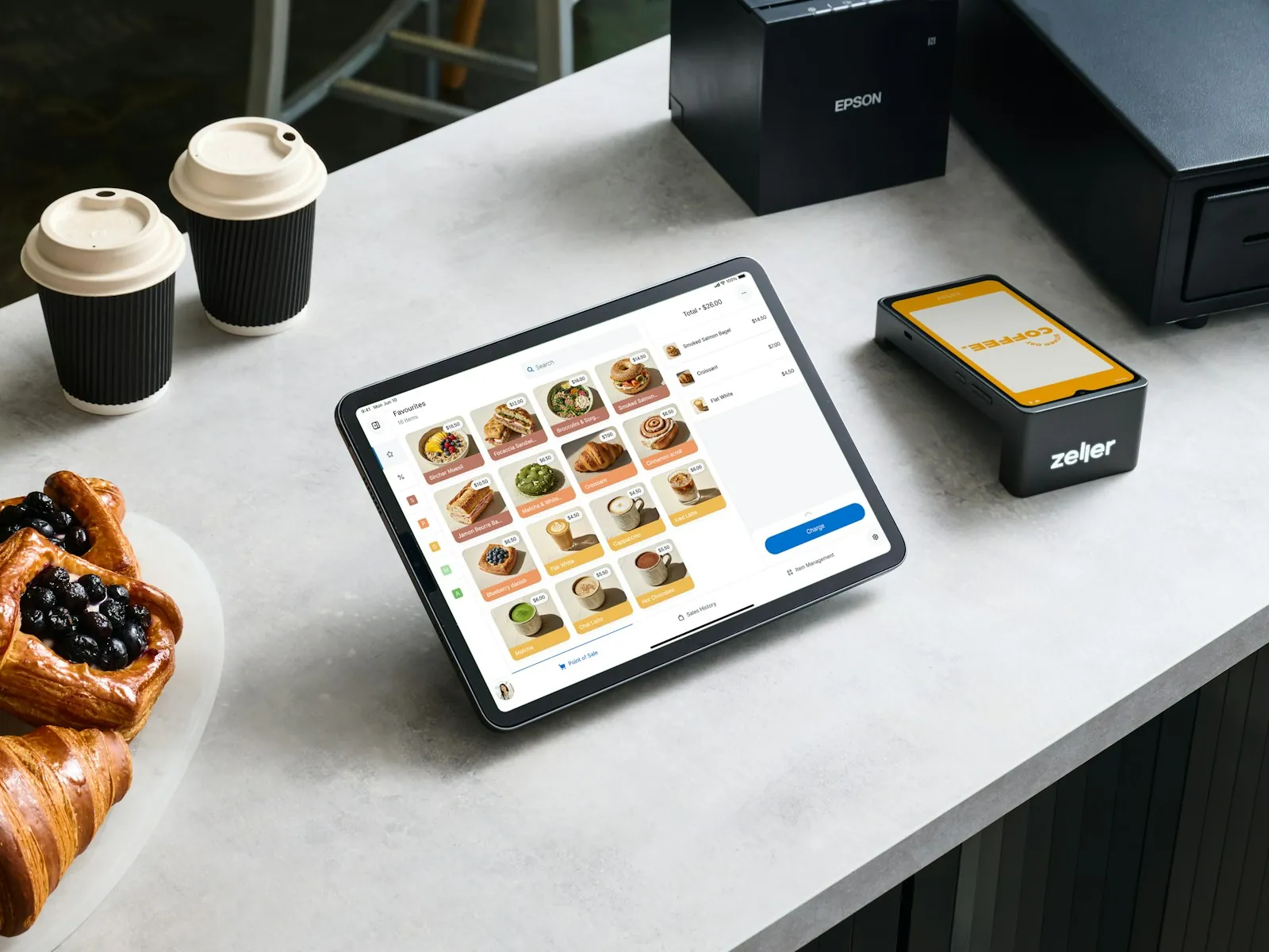 Ordering tablet and receipt printer on a shop counter